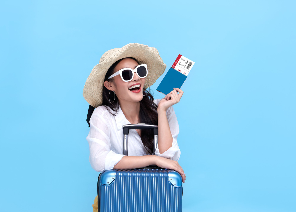 Happy Young Asian Tourist Woman Holding Passport Boarding Pass With Baggage Going Travel Holidays Blue Background