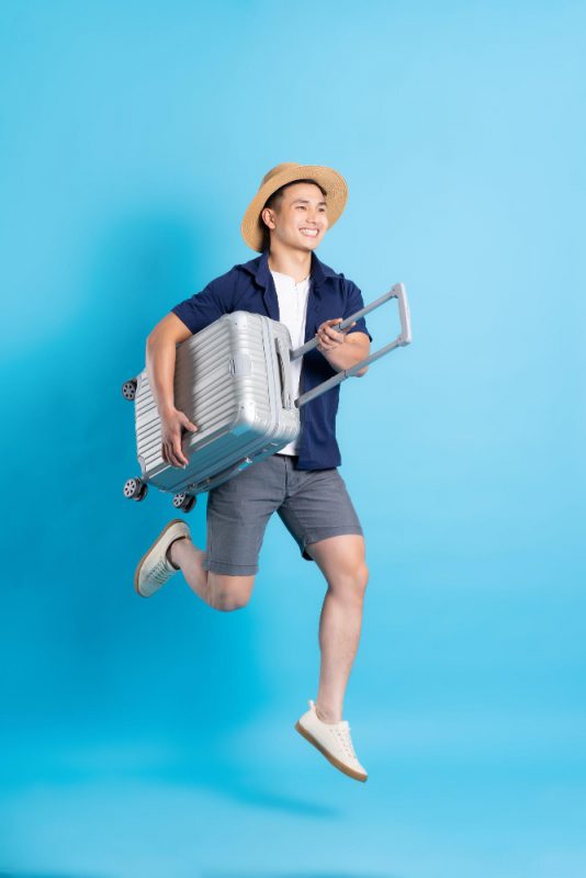 Travel Asian Man Portrait Isolated Blue Background