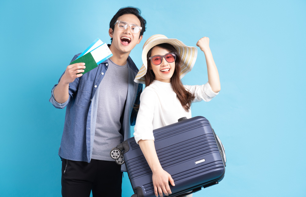 Young Asian Couple Happily Traveling Together